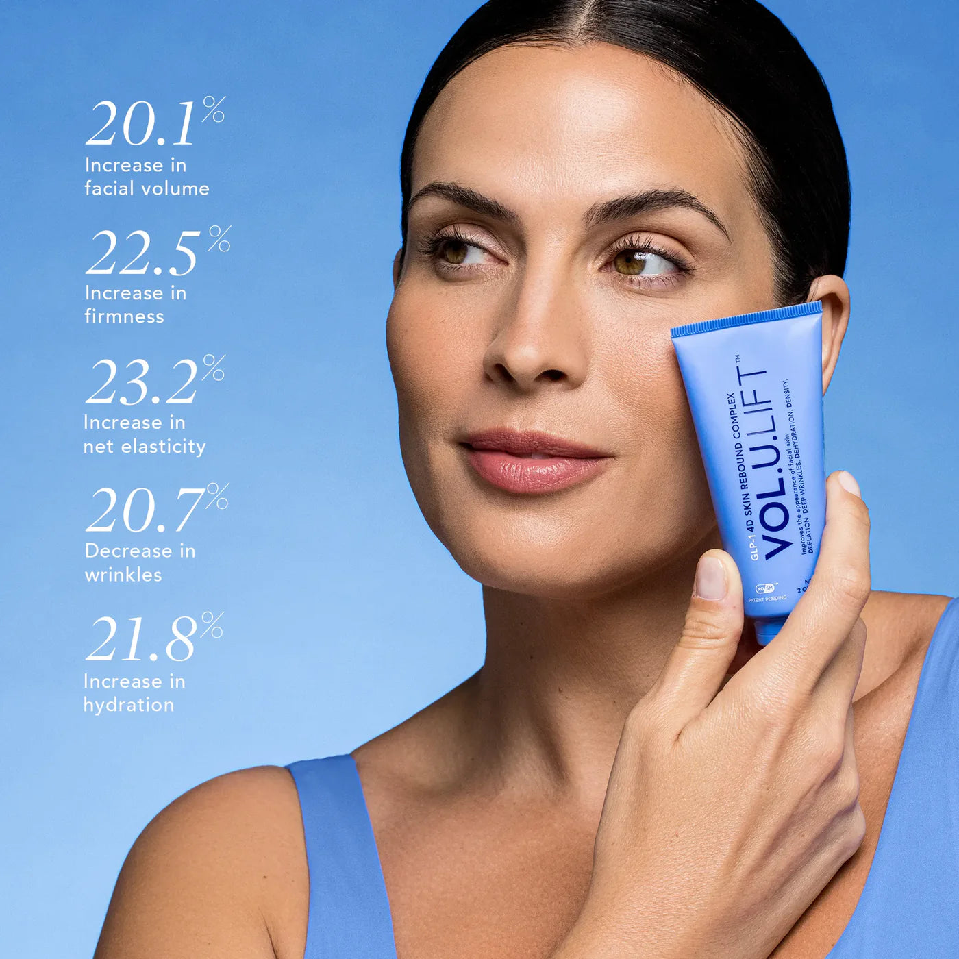 Woman holding a VoluLift product with skincare benefits displayed on a blue background