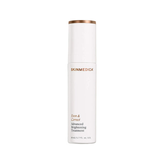 A white cylindrical skincare bottle with a metallic rose gold cap band, featuring the brand name 'SKINMEDICA' and product text 'Even & Clear Advanced Brightening Treatment' on a white background.