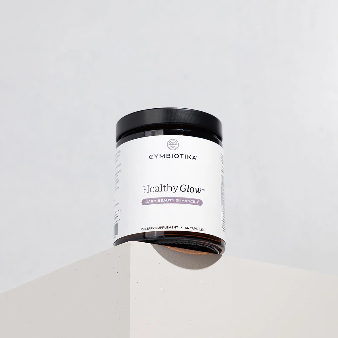 Cymbiotika Healthy Glow supplement container on a white background
