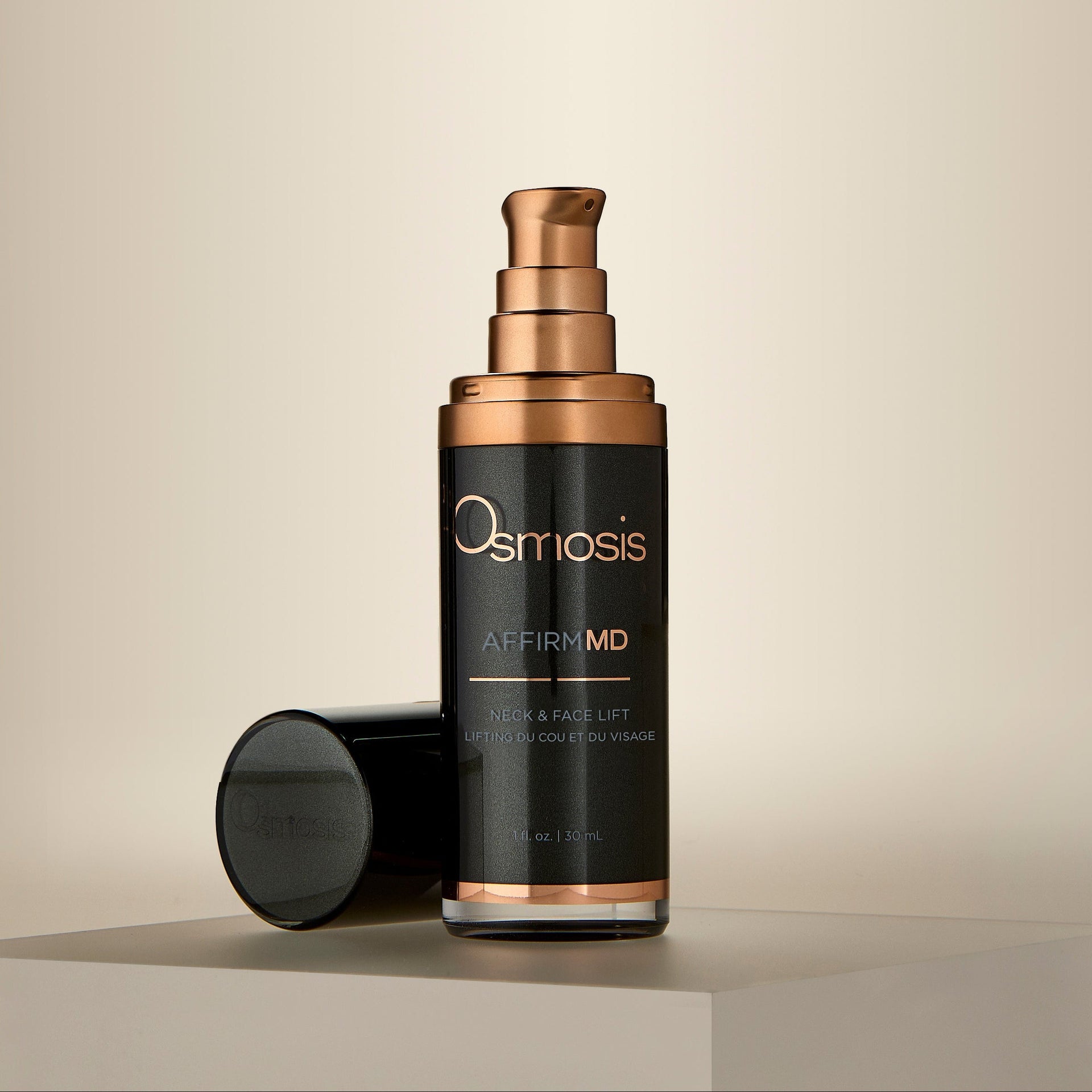 Osmosis Skincare Affirm MD bottle with black cap on a beige background
