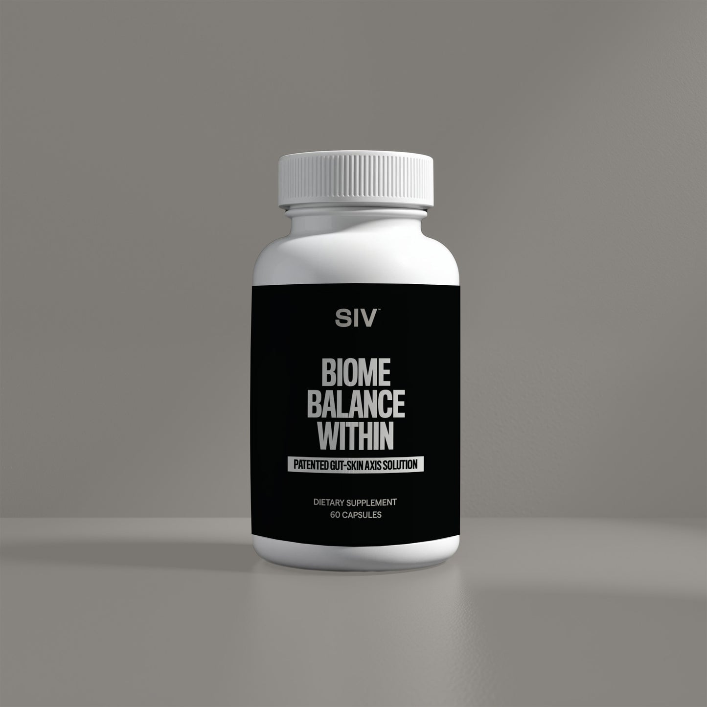 Supplement bottle labeled 'Biome Balance Within' on a gray background