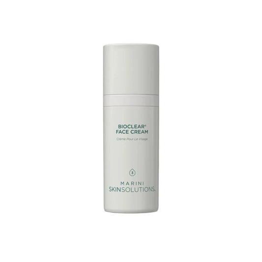 A white cylindrical bottle of Marini Skinsolutions BioClear Face Cream, centered against a clean white background with a soft, translucent cream smear behind it.