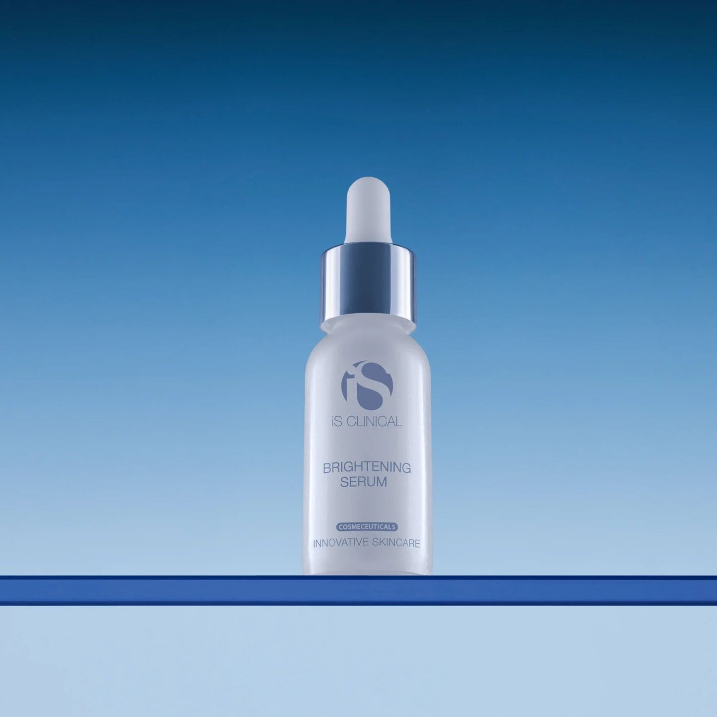 iS Clinical Brightening Serum bottle on a gradient blue background