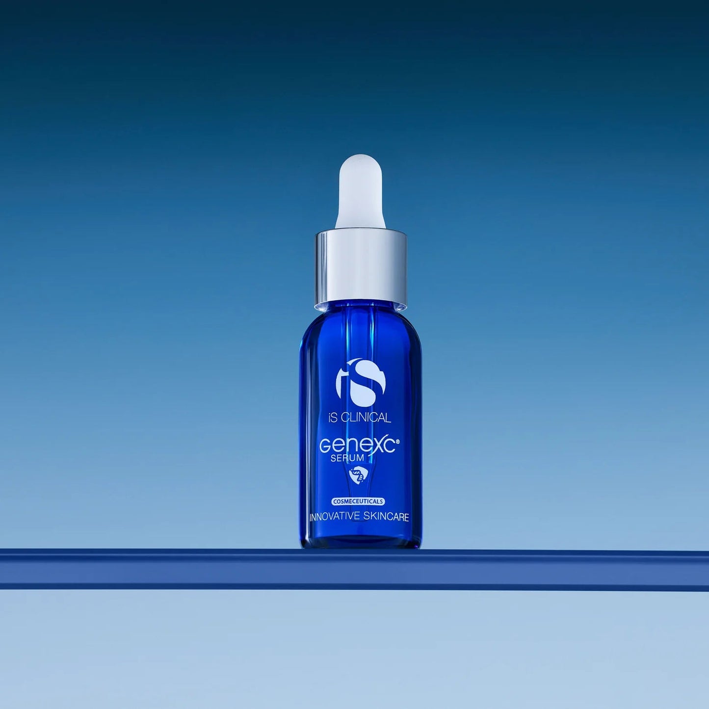Blue skincare serum bottle with dropper on a blue background