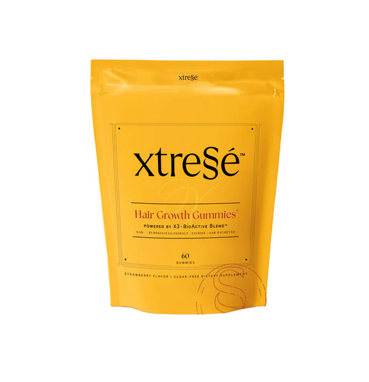 xtreSe hair growth gummies package on a yellow background