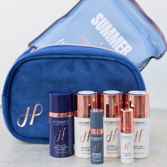 Set of skincare products with a blue pouch labeled 'Summer' on a light background