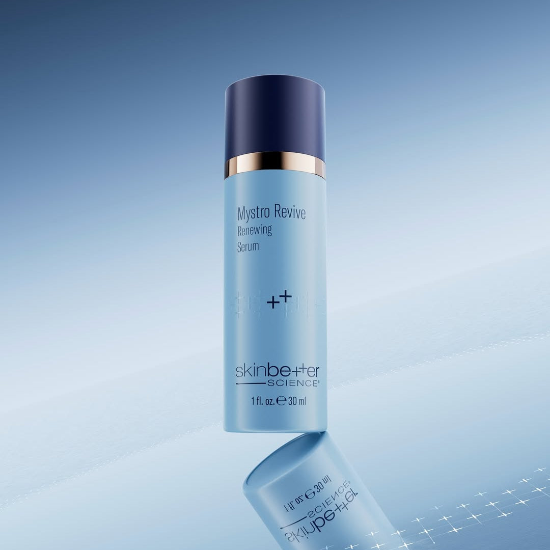 Skincare bottle labeled 'Mystro Revive' by 'skinbeauter science' on a gradient blue background