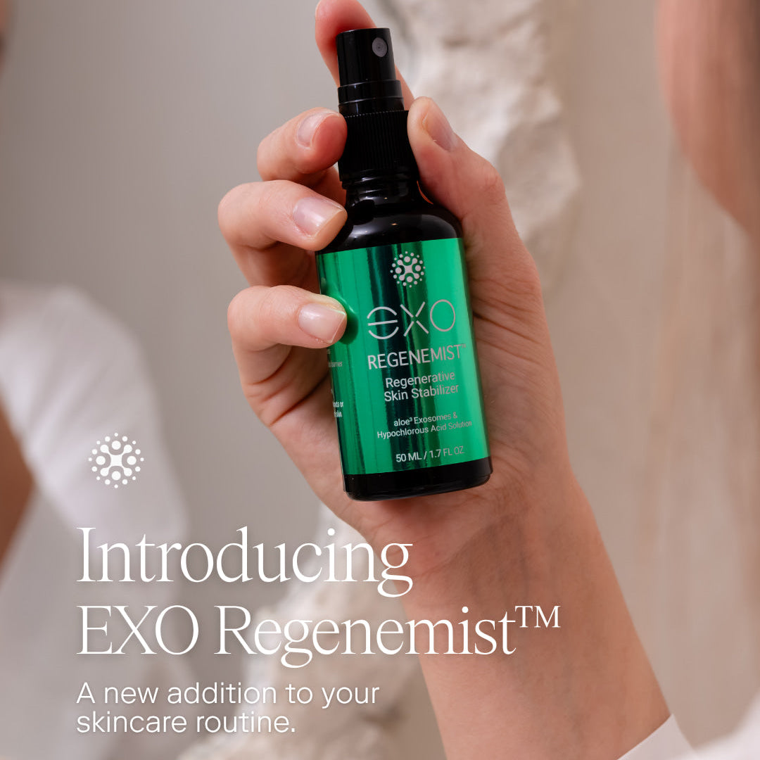 A hand holding a small black spray bottle with a bright green label reading EXO Regenemist, with a softly blurred indoor background and overlaid marketing text.