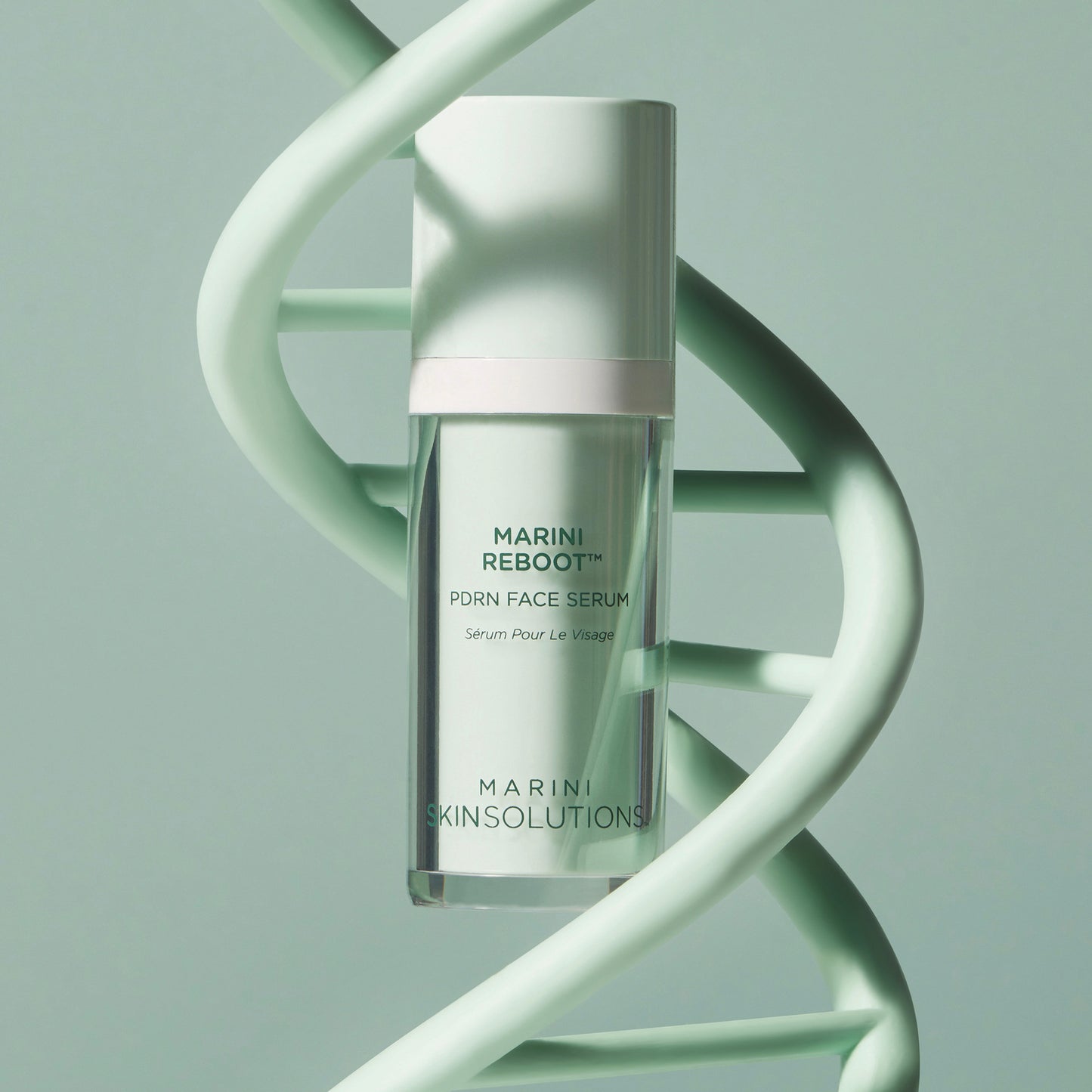 Marini Reboot serum bottle on a light green background