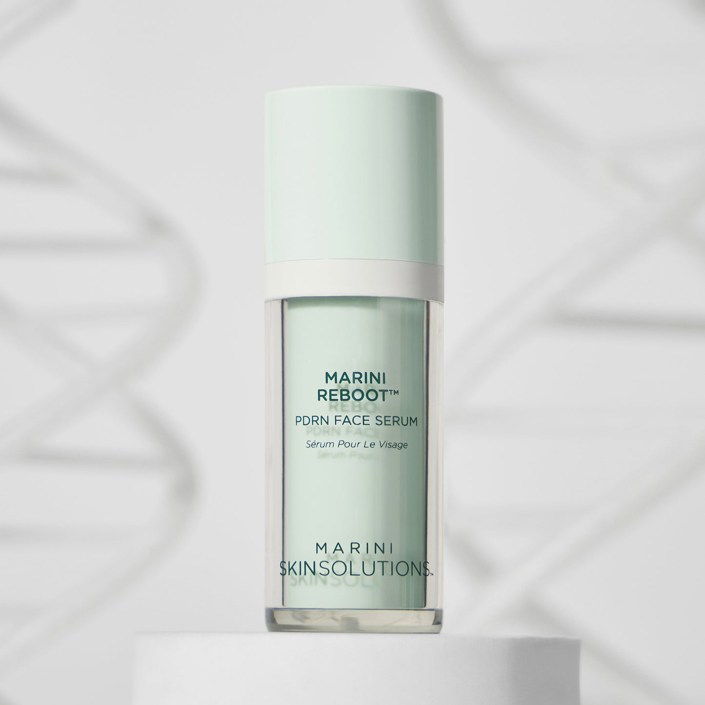 Skincare serum bottle labeled 'Marini Reboot' on a light background