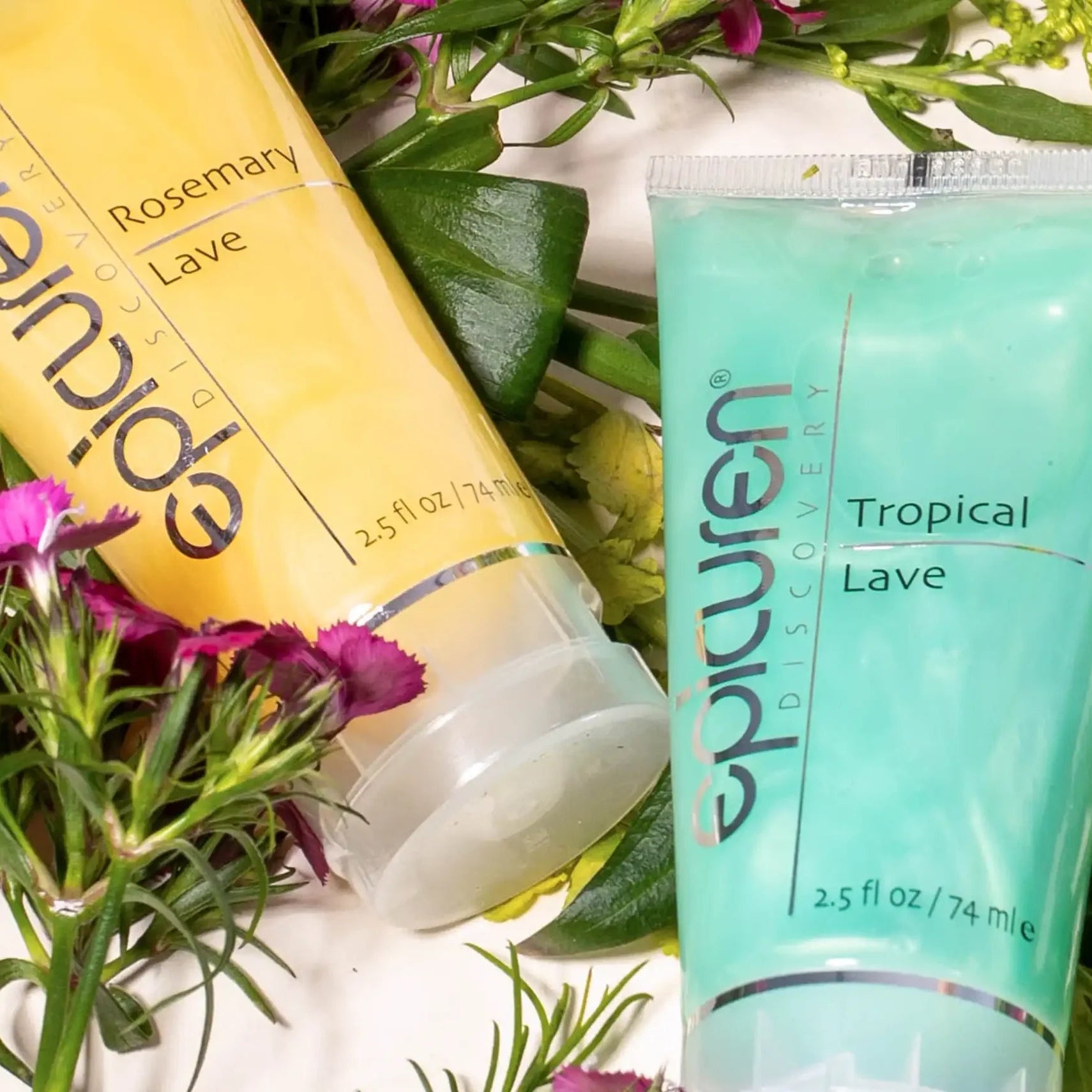 Two tubes of epicuren products with floral and greenery background