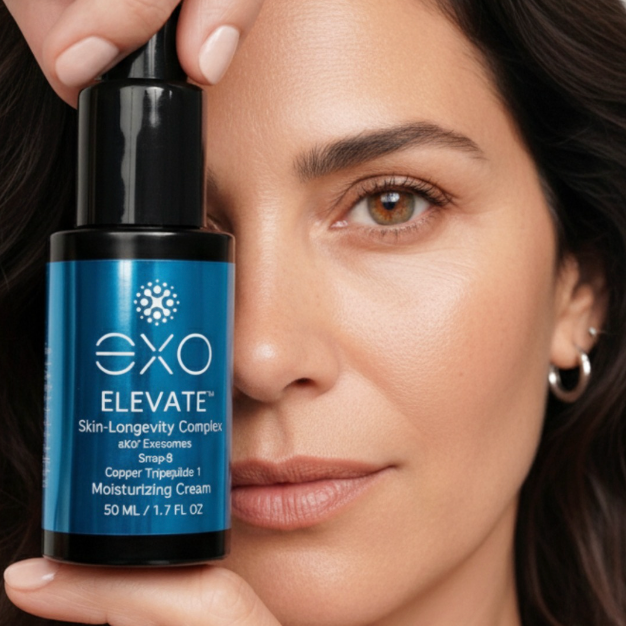 Woman holding a bottle of EXO Elevate skincare product close to her face.
