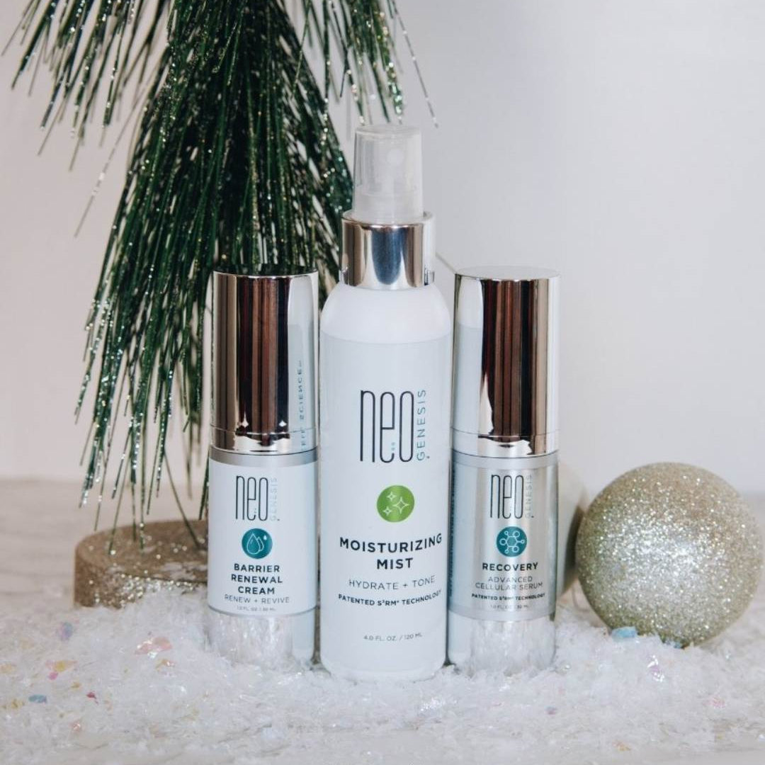 NeoGenesis skincare products on a decorative surface with a small tree and ornament.