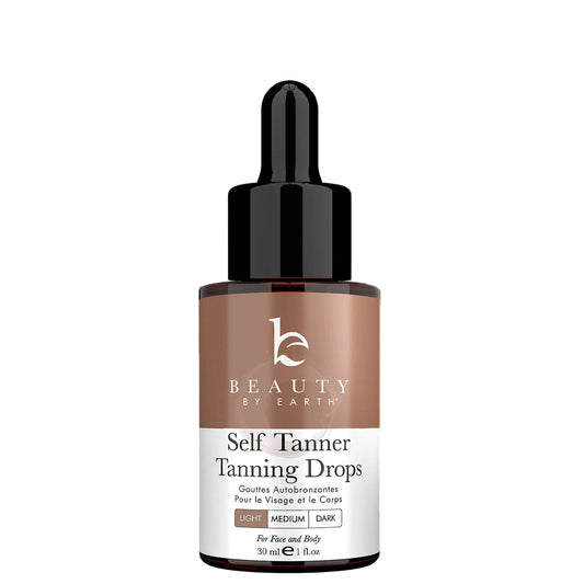 Bottle of Beauty by Earth Self Tanner Tanning Drops on a light gray background