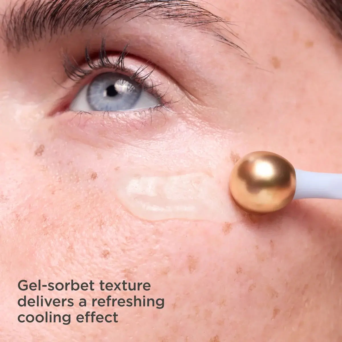 Close-up of a person applying a gel-sorbet texture to their skin with a dropper.