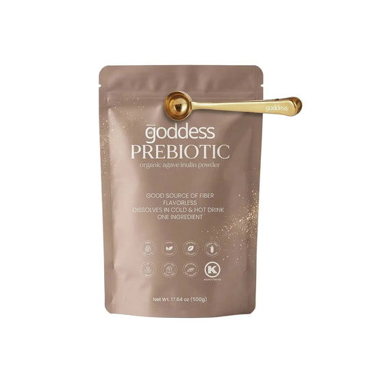 Goddess Prebiotic packaging with a gold scoop on a light background