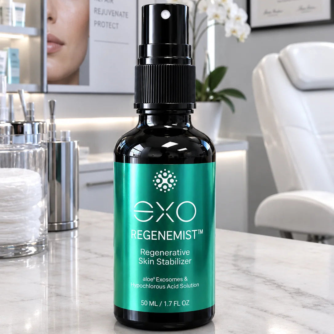 EXO Regenemist Regenerative Skin Stabilizer in a 50 mL black spray bottle with a teal label, set on a marble counter in a modern spa environment.